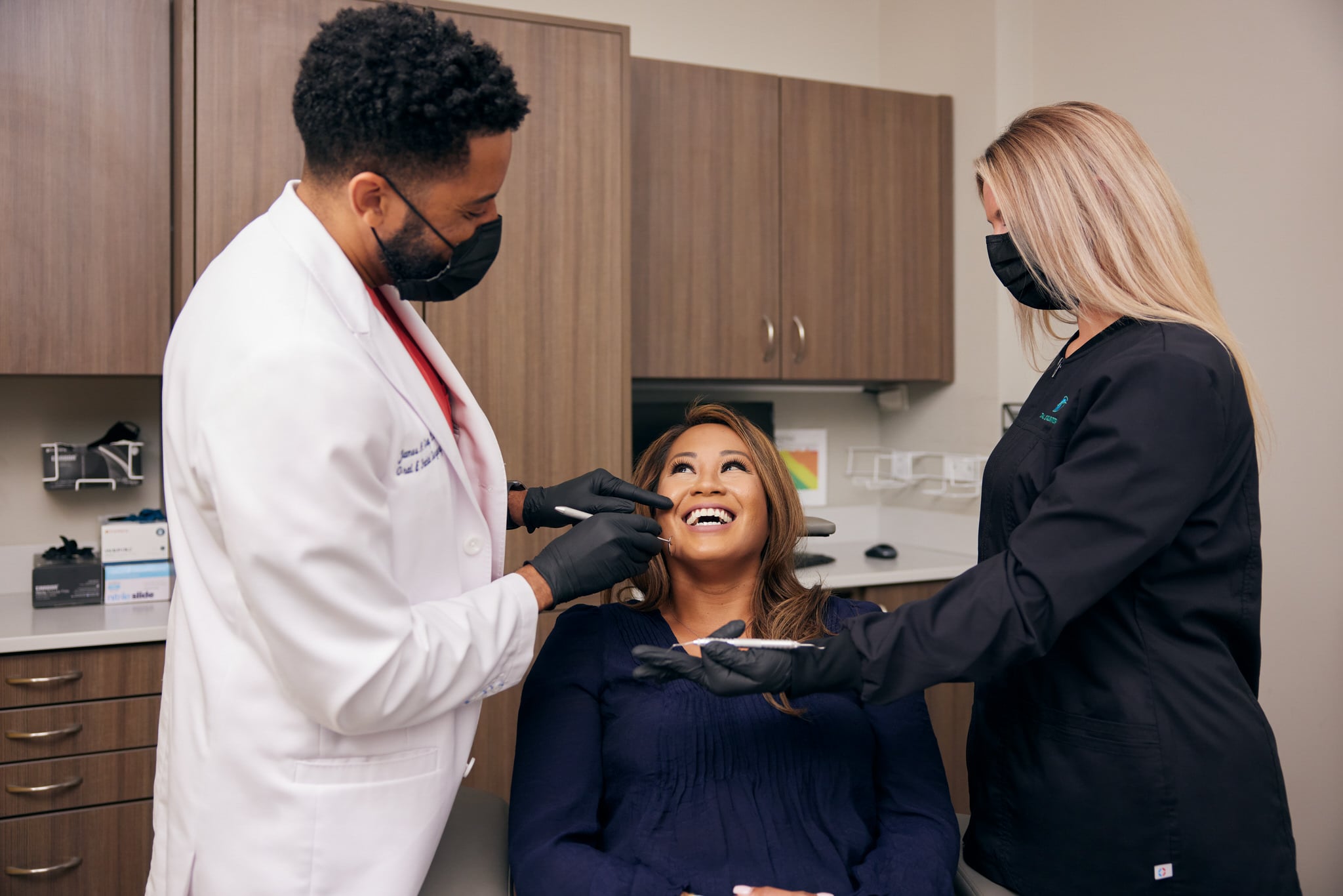 Dentist and care team performing services