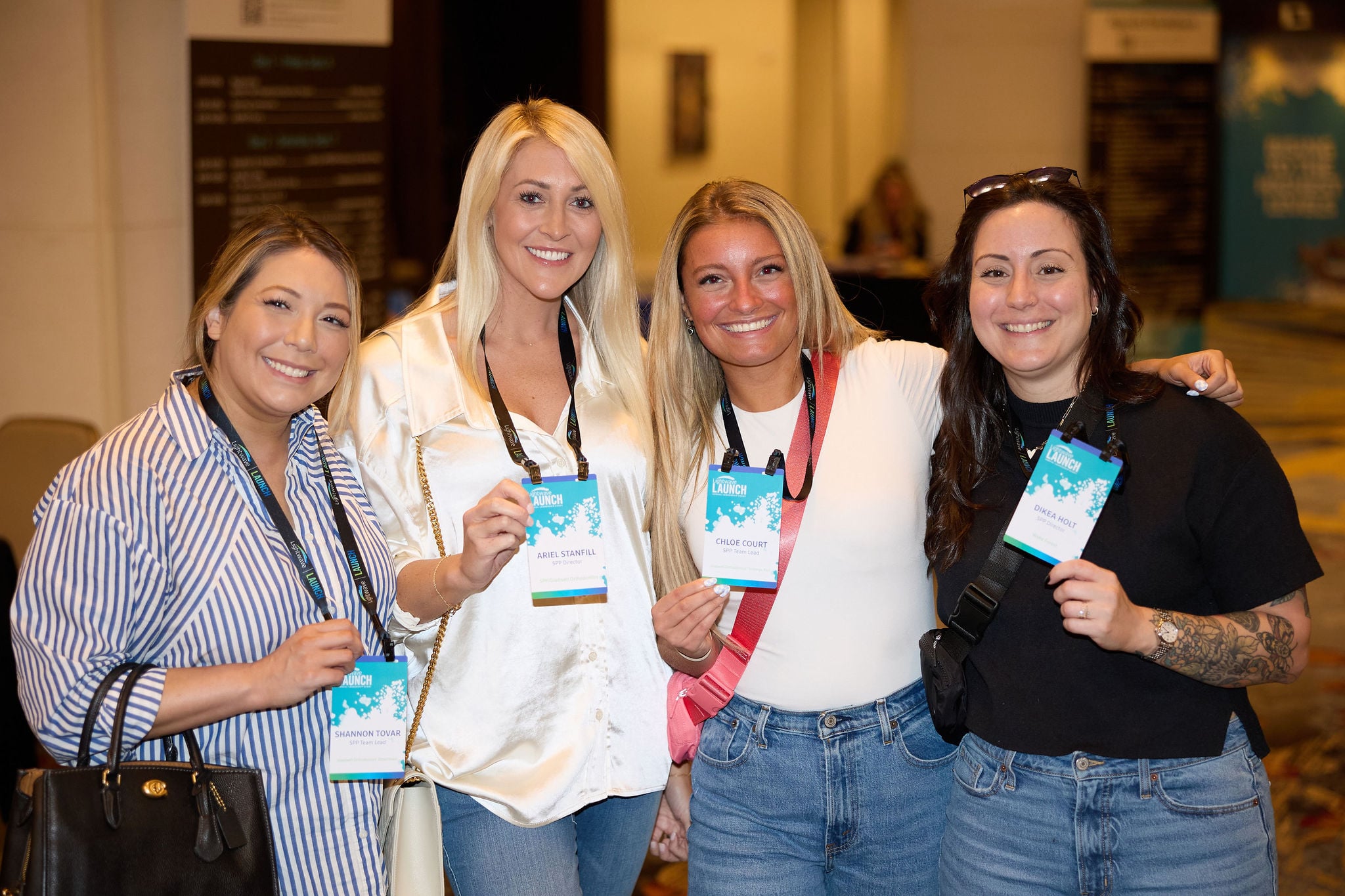 four women smiling at Lightwave LAUNCH 2024 event