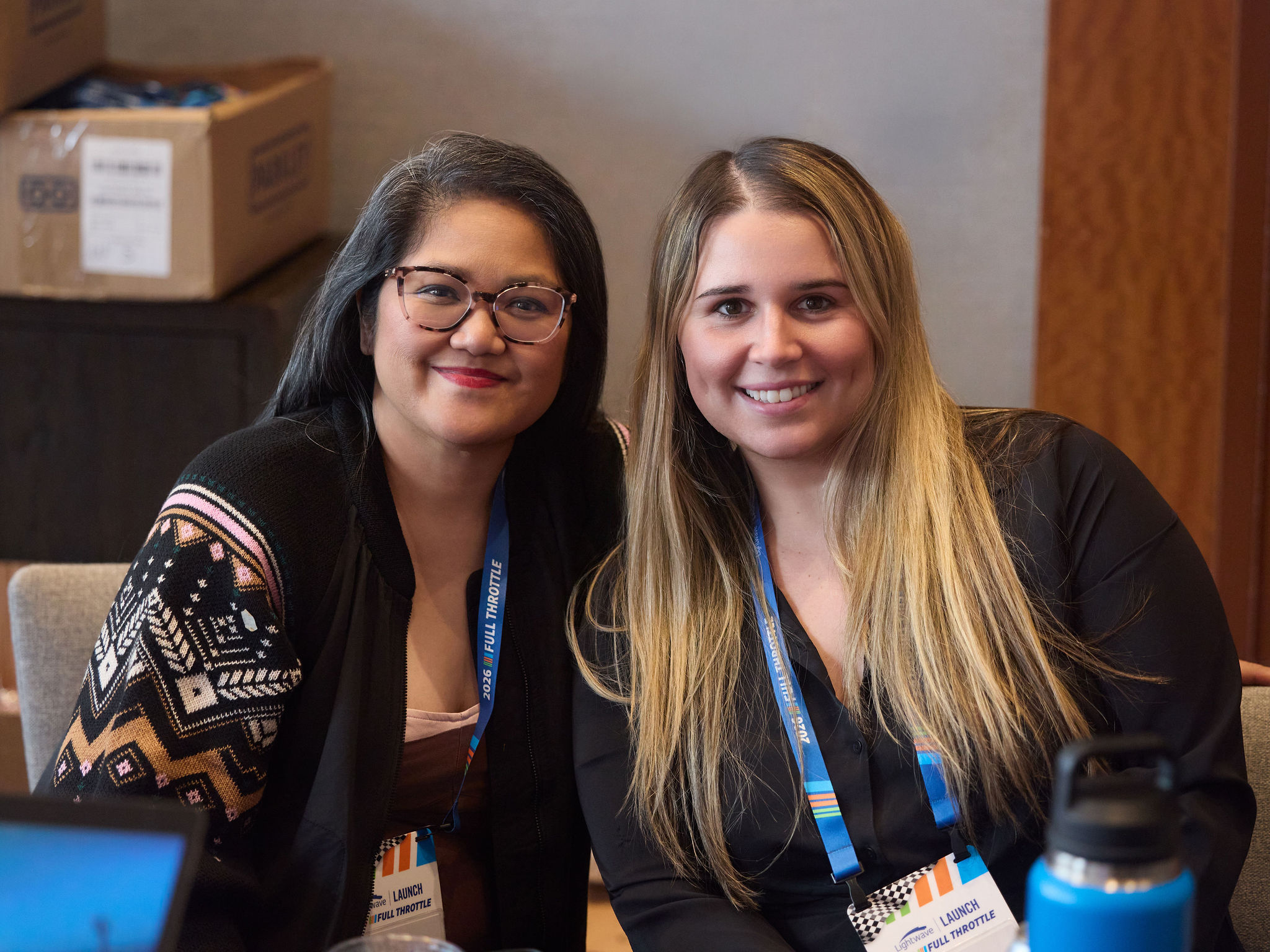 Two dental professionals at a Lightwave Dental Launch event